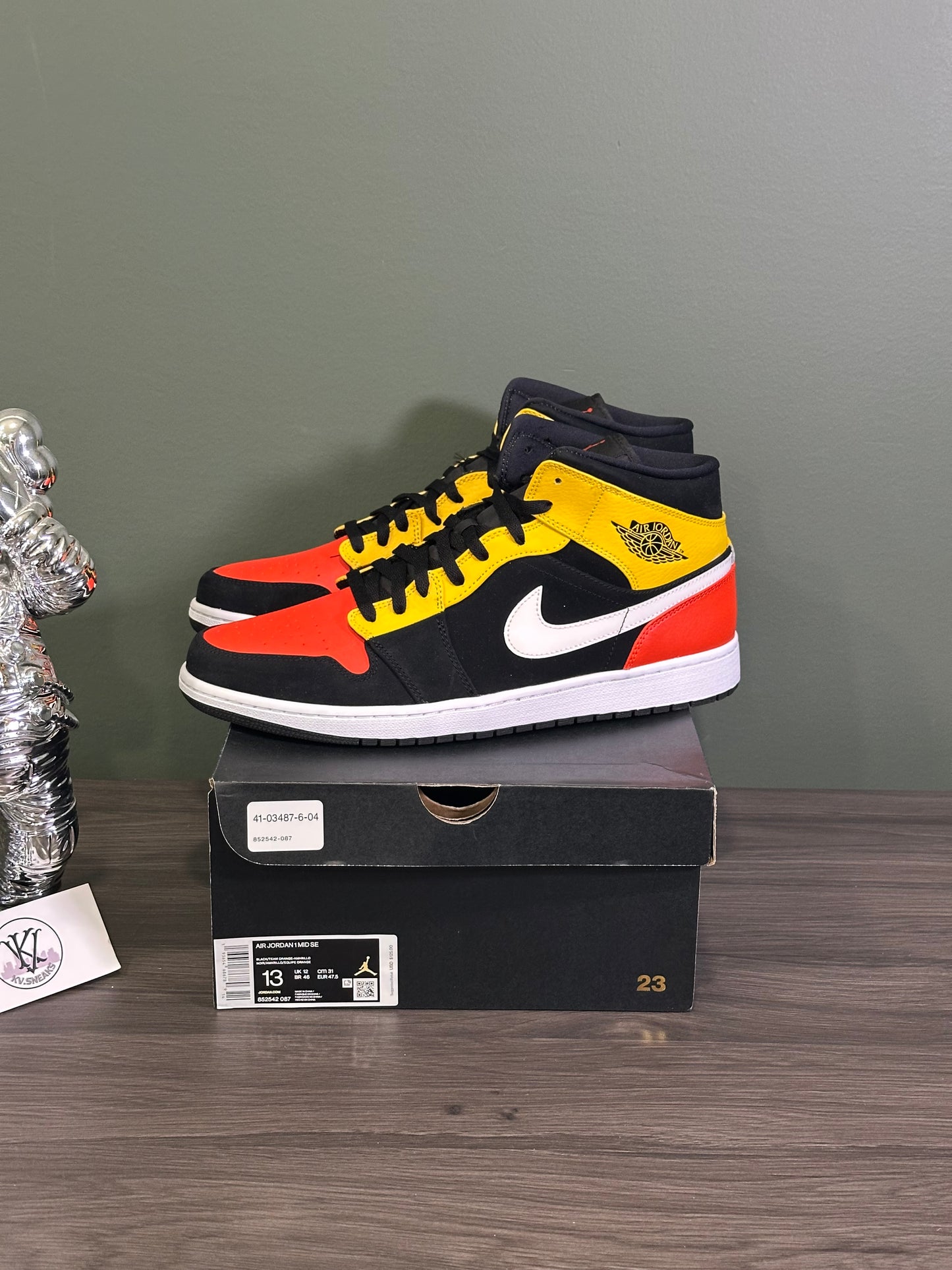 Jordan 1 Mid Black Amarillo Orange