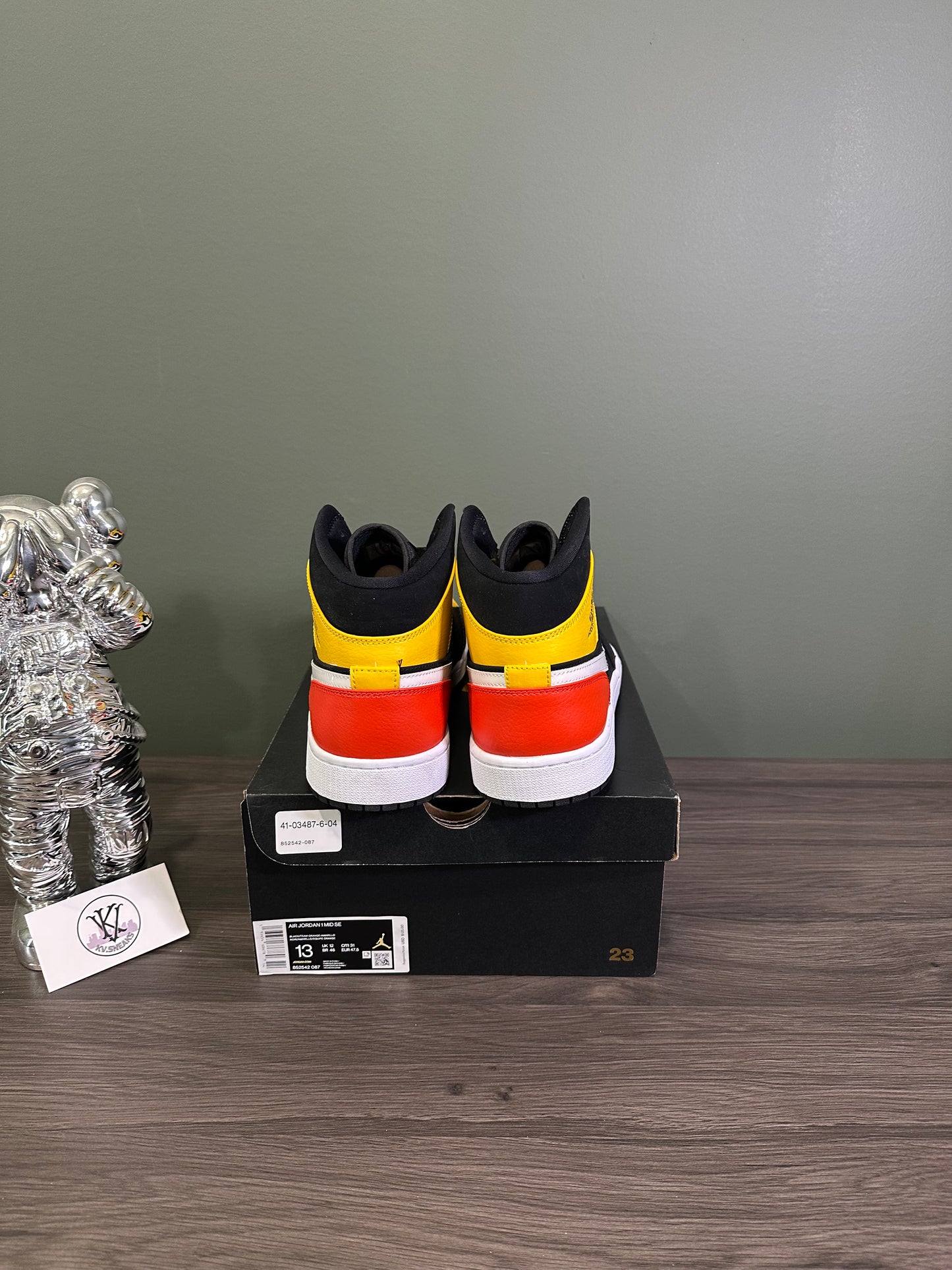 Jordan 1 Mid Black Amarillo Orange